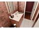 Safari themed half bathroom with sink and unique wallpaper at 136 W Loretta Dr, Indianapolis, IN 46217