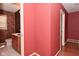 The bathroom features a wood cabinet vanity and funky wallpaper at 136 W Loretta Dr, Indianapolis, IN 46217
