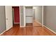 Gray bedroom with hardwood floors, closet and entry doorways at 136 W Loretta Dr, Indianapolis, IN 46217
