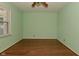 Bright and clean bedroom with hardwood floors, ceiling fan, and a window at 136 W Loretta Dr, Indianapolis, IN 46217