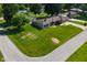 An aerial view of a charming single-story home with a well-manicured lawn at 136 W Loretta Dr, Indianapolis, IN 46217