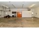 Large garage with built in shelving and a concrete floor at 136 W Loretta Dr, Indianapolis, IN 46217
