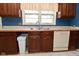 Traditional kitchen with abundant cabinets, tile floors, and a double stainless steel sink at 136 W Loretta Dr, Indianapolis, IN 46217