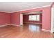 Spacious living room featuring gleaming hardwood floors and neutral color palette at 136 W Loretta Dr, Indianapolis, IN 46217