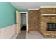 Cozy living room features a stone fireplace and neutral carpet at 136 W Loretta Dr, Indianapolis, IN 46217