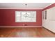 Bright living room with hardwood floors, a large window, and a stylish chandelier at 136 W Loretta Dr, Indianapolis, IN 46217