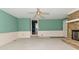 The living room boasts a stone fireplace and views to the entry and hall at 136 W Loretta Dr, Indianapolis, IN 46217