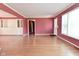 Bright living room with hardwood floors and built-in storage at 136 W Loretta Dr, Indianapolis, IN 46217