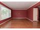 Bright living room with large window, hardwood floors and fresh paint at 136 W Loretta Dr, Indianapolis, IN 46217