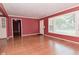 Spacious living room with hardwood floors, bright light, and convenient built-ins at 136 W Loretta Dr, Indianapolis, IN 46217