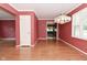 Inviting living room boasting hardwood floors, a modern chandelier, and access to other rooms at 136 W Loretta Dr, Indianapolis, IN 46217