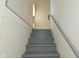 Basement staircase has painted steps and handrail at 136 W Loretta Dr, Indianapolis, IN 46217