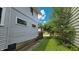 Side view of home, showing the clean lines, windows, and well-kept landscaping at 1427 N Lasalle St # 1427, Indianapolis, IN 46201