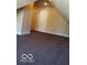 Bedroom view featuring plush carpeting and a modern interior door at 1553 W New York St, Indianapolis, IN 46222