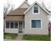 Charming home featuring a screened-in porch, neutral siding, and a cozy facade at 1553 W New York St, Indianapolis, IN 46222