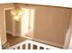 Hallway featuring an ornate chandelier and providing views of other rooms in the home at 1553 W New York St, Indianapolis, IN 46222