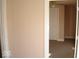 Hallway offers an open view into an adjacent carpeted room, creating a sense of flow at 1553 W New York St, Indianapolis, IN 46222
