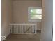 Hallway view featuring carpeted stairs at 1553 W New York St, Indianapolis, IN 46222