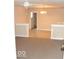 Open-concept living area featuring tiled floors and a decorative ceiling fan at 1553 W New York St, Indianapolis, IN 46222