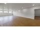 A bright basement with three windows providing natural light and hardwood floors at 16512 Grand Cypress Dr, Noblesville, IN 46060
