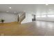 Open basement view featuring stairs, large windows, and a beverage station, creating an inviting space at 16512 Grand Cypress Dr, Noblesville, IN 46060