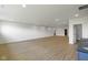 Finished basement with modern flooring, recessed lighting, and an open layout at 16512 Grand Cypress Dr, Noblesville, IN 46060