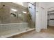 Luxurious bathroom featuring a glass-enclosed shower with mosaic tile and a built-in bench at 16512 Grand Cypress Dr, Noblesville, IN 46060
