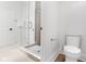 Bright bathroom featuring a glass enclosed shower with gray subway tile and a modern toilet at 16512 Grand Cypress Dr, Noblesville, IN 46060