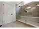 Bathroom featuring a luxurious glass-enclosed shower with elegant tilework and modern fixtures at 16512 Grand Cypress Dr, Noblesville, IN 46060