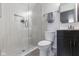 Modern bathroom with glass shower, a built-in shower niche, and updated fixtures at 16512 Grand Cypress Dr, Noblesville, IN 46060