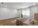 Well-lit bedroom featuring hardwood floors, natural light, and modern accents at 16512 Grand Cypress Dr, Noblesville, IN 46060