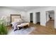 Inviting bedroom featuring neutral decor, hardwood floors, and an open layout at 16512 Grand Cypress Dr, Noblesville, IN 46060