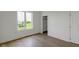 A bedroom with a closet and a large window, offering comfort and convenience at 16512 Grand Cypress Dr, Noblesville, IN 46060