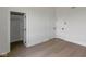 An open bedroom with hardwood floors, closet and two doors, offering comfort and convenience at 16512 Grand Cypress Dr, Noblesville, IN 46060