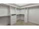 Well-organized walk-in closet featuring custom shelving and drawers for ample storage at 16512 Grand Cypress Dr, Noblesville, IN 46060