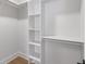 A well-organized walk-in closet with custom shelving and ample storage space at 16512 Grand Cypress Dr, Noblesville, IN 46060