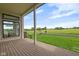 Comfortable covered patio showcasing views of the expansive yard and picturesque scenery at 16512 Grand Cypress Dr, Noblesville, IN 46060