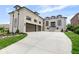 Stunning brick home with three-car garage and manicured lawn with elegant landscaping and concrete driveway at 16512 Grand Cypress Dr, Noblesville, IN 46060