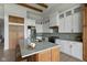 Bright eat-in kitchen featuring a kitchen island, modern appliances, and white cabinetry at 16512 Grand Cypress Dr, Noblesville, IN 46060