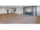 Expansive living room featuring a modern bar with floating shelves and a mini fridge, great for entertaining at 16512 Grand Cypress Dr, Noblesville, IN 46060