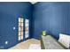 Blue office with wainscoting, a large window, and stylish desk at 16512 Grand Cypress Dr, Noblesville, IN 46060