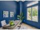 Blue office with white trim, a large window, and tasteful decor at 16512 Grand Cypress Dr, Noblesville, IN 46060