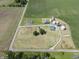 Aerial view of farm land with silos, barns, and a small home at 17550 N 200 W, Summitville, IN 46070