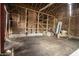 Rustic barn interior featuring a dirt floor and exposed wood construction, offering potential for storage at 17550 N 200 W, Summitville, IN 46070