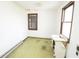Small bedroom with a window and a vanity, featuring olive-green carpeting and a vintage charm at 17550 N 200 W, Summitville, IN 46070
