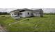 Exterior view of white sided home with shed and partial lawn at 17550 N 200 W, Summitville, IN 46070