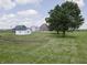 Farm land with outbuildings, barns, and a large tree at 17550 N 200 W, Summitville, IN 46070
