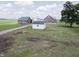 Spacious farm featuring multiple outbuildings, barns, and a shed at 17550 N 200 W, Summitville, IN 46070