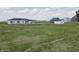Farm land with a home, outbuildings, barns, and a large grassy field at 17550 N 200 W, Summitville, IN 46070