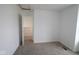 Bedroom features light colored carpet and a view to a potential neighbor at 1817 Real St, Indianapolis, IN 46240